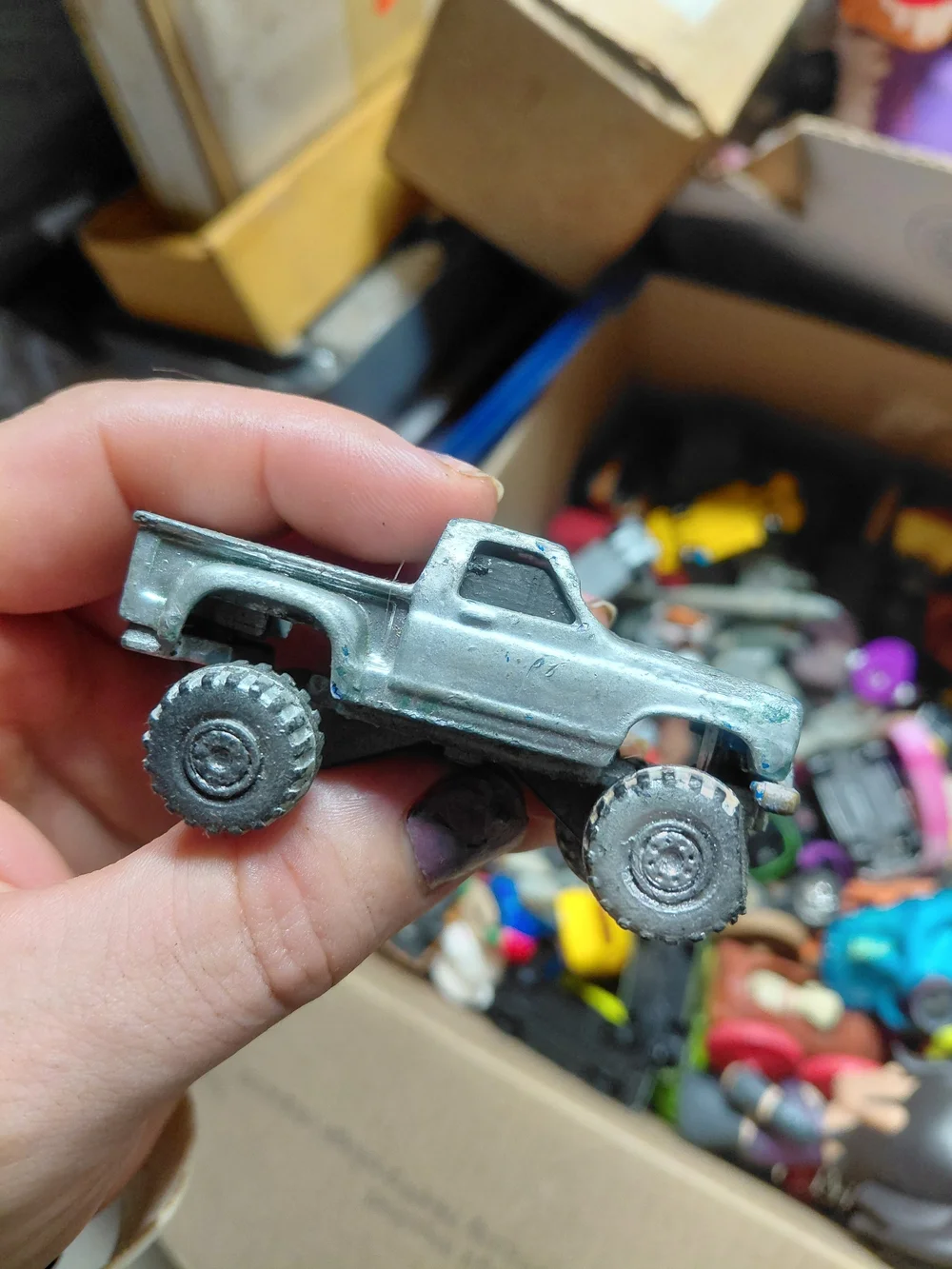 modified 1980s Hot Wheels or similar 1:64 scale die-cast truck, likely a Chevrol